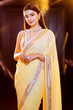 Yellow georgette saree with pearl and sequin embroidered border. Comes with unstitched blouse fabric.
Components:2
Pattern:Embroidery
Type of Work:Sequin and Pearl
Fabric:Georgette
Color:Yellow
Other Details:
Embroidered border
Note: Blouse worn by the model is not for sale, please contact the customer service to purchase the blouse separately
Occasion:Mehendi and Haldi,Sangeet - Aza Fashions Yellow Georgette Saree, Sequin Saree, Yellow Saree, Embroidered Saree, Types Of Work, Embroidered Border, Luxury Sale, Georgette Saree, Georgette Sarees