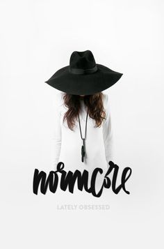 a woman wearing a black hat and white shirt with the word momcare written on it