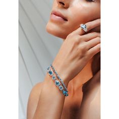 This is part of Chairish’s Fine Jewelry assortment.  This 25.92ct Mixed Cut Blue Topaz and Diamond Tennis Bracelet in 18K gold showcases 25.92 carats endlessly sparkling natural blue topaz and 1.24 carats of diamonds. It measures 7 inches long in length.  Blue topaz promotes truth and forgiveness, relaxing the spirit as well as the body.  Designed with perfect pear and oval cut blue topaz set in center with halo diamonds covering some of the blue topaz to make you stand out on any occasion or ev Modern Bracelet, Modern Bracelets, Diamond Tennis Bracelet, Tennis Bracelet Diamond, Tennis Bracelet, Halo Diamond, Oval Cut, Elegant Style, Blue Topaz