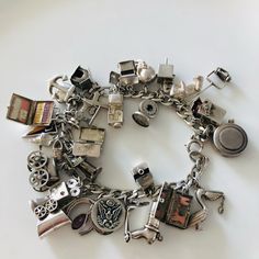 This Amazing Charm Bracelet Was My Moms. She Went To Uc Berkeley And Graduated In 1949. While At Cal She Worked At Emporium-Capwells Department Store And Bought The Charms For This Bracelet Every Payday. Many Open To Reveal Other Treasures. There Are 29 Charms. All But A Couple, That Don’t Have Space, Are Stamped Sterling And All Have Been Tested For Purity. Measures Approximately 7”-7.5” They Are In Order As Placed On The Bracelet 1.Canteen 2.Box Spring Loaded With Fire Cracker 3.Lawnmower 4.Teddy Bear W Articulated Arms & Legs 5.Monkey On Organ Grinder Box 6.Old Fashion Microphone 7.Skull W/ Articulated Mouth 8.Wishing Well 9.Jeep 10.Dog House 11.Heart 12.Anchor 13.Cross 14.Se Vintage Antique Silver Charm Bracelet Gift, Novelty Silver Hypoallergenic Charm Bracelet, Antique Silver Nickel-free Charm Bracelet For Gift, Vintage Sterling Silver Hallmarked Charm Bracelet, Tiny Fish, Travel Trunk, Antique Nickel-free Charm Bracelet Collectible, Sterling Silver Charm Bracelet, Wedding Ring Box