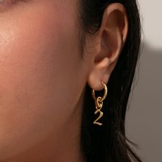 There’s nothing better than a simple gold huggie earring, especially when you can personalize it with charms. Our Spellbound Huggies are the perfect pair to your charm collection. Add your favorite charms to these mini gold hoops for a look that’s unique to you. Everyday Yellow Gold Huggie Earrings With Charms, Gold-plated Huggie Earrings With Charms, Gold Plated Huggie Earrings With Charms, Gold Huggie Earrings With Dangling Charms For Everyday, Everyday Gold Huggie Earrings With Dangling Charms, Gold Plated Huggie Earrings With Charms As Gift, Gold Plated Huggie Earrings With Charms For Gifts, Small Hoop Huggie Earrings With Charms, Minimalist Yellow Gold Hoop Earrings With Charms