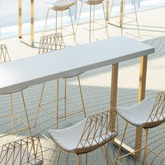 a table with four chairs next to each other on the floor in an empty room