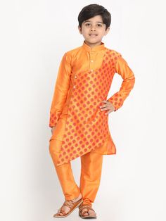 Vastramay Orange Silk Blend Ethnic Print Kurta Pyjama Sibling Set Introducing the vibrant Vastramay Orange Silk Blend Ethnic Print Kurta Pyjama Sibling Set, perfect for siblings who love to match in style. Features Beautiful silk blend fabric for a luxurious feel Ethnic print design for a traditional look Comfortable and stylish kurta pyjama set Perfect for siblings who want to match in style Specifications Color: Orange Material: Silk blend Sizes: Available in various sizes for siblings of diff Orange Bandhani Print Traditional Wear For Eid, Bollywood Style Long Sleeve Pant Set For Navratri, Diwali Long Sleeve Pant Set With Zari Work, Long Sleeve Pant Set With Zari Work For Diwali, Traditional Long Sleeve Churidar With Bandhani Print, Bollywood Style Long Sleeve Pant Set For Eid, Bollywood Style Long Sleeve Pant Set For Festive Occasions, Bollywood Style Long Sleeve Festive Pant Set, Festive Bollywood Long Sleeve Pant Set