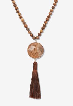 a wooden beaded necklace with tassels and a pendant hanging from the front