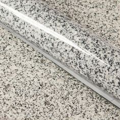 a close up view of a granite counter top with the edge cut off from it