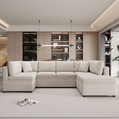 a living room with a sectional couch and bookshelves