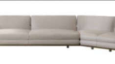 a white leather couch sitting on top of a wooden table