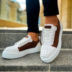 Introducing the "Celtics Earthy Frame." Embrace the pristine allure of white, elegantly bordered by rich brown sides and highlighted by a spiked toe cap. Meticulously crafted from vegan leather, these sneakers exude style and embody Apollo's orthopedic excellence. Key Features: White Vegan Leather with Brown Sides and Spiked Toe Cap: Offering purity with a dash of flair. Apollo's Orthopedic Comfort: Seamlessly blending style with unmatched foot wellness. Celtics Design by Apollo Moda: Tailored f Vegan Sneakers, Custom Sneakers, Blending, Vegan Leather, White And Black, Women Accessories, Key, Sneakers, Frame