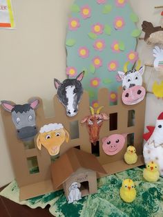 there are many farm animals made out of cardboard