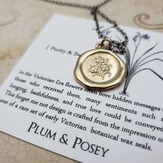 Lily {Purity & Sweetness}During the Victorian era flowers often bore hidden messages to those who received them.Sentiments such as longing, bashfulness, and true love could be conveyed through the flowers given & received.Handcrafted from the impression of an early 19th century French wax seal set, this pendant features a spray of lilies, symbolic of Purity & Sweetness. The chain shown in the photos is our 'Antiqued Rolo'Materials: Silver, Gold, Gold vermeil Gold vermeil is a thick l Vintage Charm Necklace For Mother's Day, Gold Flower Necklace With Vintage Charm, Vintage Charm Necklace For Mother's Day Anniversary, Vintage Charm Necklaces For Anniversary And Mother's Day, Vintage Charm Necklaces For Mother's Day Anniversary, Anniversary Medallion Necklace With Flower Charm, Medallion Necklace With Flower Charm For Anniversary, Vintage Flower Charm Necklace For Gift, Flower Shaped Necklace With Vintage Charm As Gift