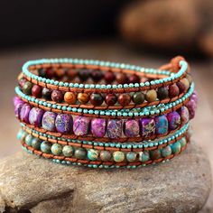 This Handmade Mixed Jasper Bohemian Vintage Leather Wrap Bracelet is a unique and stylish accessory that combines the natural beauty of mixed Jasper stones with a vintage leather design. The bracelet features a variety of different Jasper stones, each with its own unique pattern and color. Jasper is a grounding stone that is said to bring stability and balance to the wearer. It is also believed to have a calming effect and to help with emotional healing. The leather strap of this bracelet is des Cape Diablo, Purple Jasper, Wrap Armband, Jewerly Making, Bohemian Jewellery, Imperial Jasper, Beaded Wrap Bracelets, Natural Stone Bracelets, Beaded Wraps