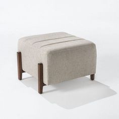 the footstool is made out of wood and fabric