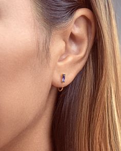 Hug your ear in a unique look that features amethyst zirconia, and wear a stunning pair of Huggies earrings with these Amethyst Zirconia Huggie Hoop Earrings.  Featuring a great look and made with black zirconia accents, these tiny earrings are the ideal helix hoops. They encircle your ears with a fantastic look! This cute piercing is also an excellent zirconia gift for those who love to wear unique ear jewelry!  Give the classic look of amethyst jewelry and a beautiful design in cristal earring Cute Piercing, Gold Huggies, Multiple Earrings, Stick Earrings, Earrings Rose Gold, Open Hoop Earrings, Tiny Earrings, Amethyst Jewelry, Huggie Earrings