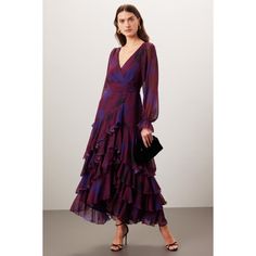 Purple floral chiffon (100% Polyester). Wrap. Long sleeves. V-neck. Tie closure. 58" from shoulder to hemline. Imported. Spring V-neck Chiffon Cocktail Dress, Elegant V-neck Chiffon Dress For Fall, Chiffon V-neck Midi Dress For Date Night, V-neck Chiffon Dress For Fall Party, Purple Chiffon V-neck Maxi Dress, Elegant Floral Print V-neck Chiffon Dress, Formal Long Sleeve Chiffon Dress With Floral Print, Spring Formal Flowy V-neck Dress, Elegant Fall Chiffon V-neck Dress