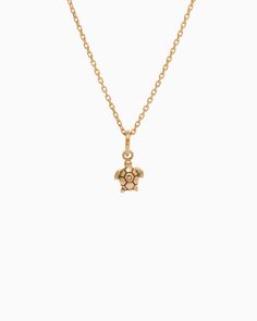 The Turtle Charm is handcrafted in 14K solid gold and features a detailed design inspired by sea turtles, celebrated as iconic symbols of the Caribbean. Playful yet sophisticated, this charm complements any look. Pair with your favorite hook bracelet or dainty chain, sold separately. Metal: 14K solid gold Dimensions: 9.5mm x 6mm x 2mm Style #: GC203S Adjustable Yellow Gold Jewelry With Logo Charm, Elegant Yellow Gold Turtle Jewelry, Hook Bracelet, Turtle Charm, Sea Turtle, Solid Gold, Gold