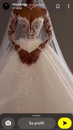 a woman wearing a wedding dress with long sleeves