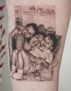 a black and white photo on the leg of a woman with three children in it