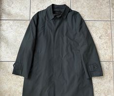 "Here is a vintage sack rain coat by \"Brent\" (a line for \"Montgomery Ward\"), that can be dated to the 1960s. It has no size tag, but could work for sizes 42 through 44 Regular, depending on preferred fit; still, please use the measurements provided to ensure a proper fit. Made of what is assuredly a cotton/poly blend in a twill weave, it has a plaid pattern of very dark green, dark gray, and brown. It further features great details, like: a 4-button sack (un-darted) front with a hidden/fly f Montgomery Ward, Silk Bow Ties, Blue Paisley, Green Plaid, Online Retail, Plaid Pattern, Dark Green, 1960s, Mens Jackets