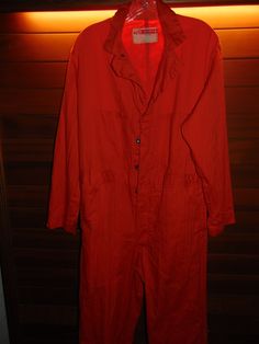 Vintage Work Wear Corp 100% Cotton Overalls, Coveralls, Jump Suit. Size 40. USA Made. Inseam Is 32". 23" Straight Across The Front, Flat, Arm Pit To Arm Pit. 1 Small Hole On The Back Of The Left Leg. All Buttons Are Rivets.       X-5 Long Sleeve Cotton Overalls With Buttons, Cotton Overalls With Sleeves And Buttons, Fall Utility Shortalls For Workwear, Cotton Shortalls For Workwear In Fall, Workwear Overalls With Bib Front And Buttons, Vintage Spring Workwear Overalls, Utility Style Bib Front Jumpsuits And Rompers For Work, Utility Bib Front Jumpsuits And Rompers For Workwear, Relaxed Fit Utility Shortalls For Workwear