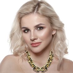 Make a bold statement with this stunning gold resin link chain necklace. Designed for those who embrace daring fashion, this lightweight piece offers a striking contrast that effortlessly elevates any outfit. Whether paired with a casual white t-shirt or dressed up for a business lunch, its versatile design ensures you stand out with confidence. A timeless accessory, this necklace is a must-have for anyone who adores statement jewelry with a classic edge. Avoid contact with water and cosmetics, such as creams or perfumes. Clean with a clean dry cloth. Bold Jewelry With Chain For Parties, Bold Chunky Chain Necklace For Party, Bold Chunky Chain Jewelry For Party, Bold Chain Jewelry For Party, Bold Chunky Chain Party Jewelry, Trendy Chunky Chain Necklace For Party, Bold Party Jewelry With Chain Detail, Bold Party Jewelry With Chunky Chain, Bold Chain Link Jewelry For Party