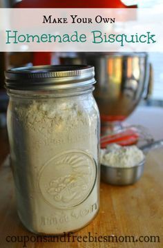 a mason jar filled with homemade biscuits sitting on top of a wooden table