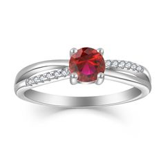 a white gold ring with a red stone and diamonds