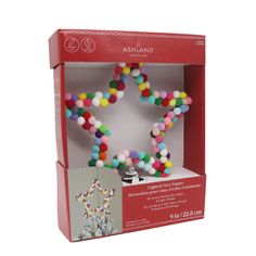 an assortment of multicolored beads in a box