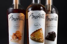 three bottles of chocolate and caramel flavored apple pie syrup on a black background