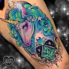 a colorful unicorn tattoo on the leg with stars in the sky and hearts around it