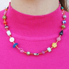 The Mariposa Beaded Necklace is fun personified. This multicolored, beaded necklace is sure to make you smile. This necklace is handmade using an assortment of beads including Czech glass and gemstone beads on a single strand of colorful loveliness! While each bead might have a different color, consistency, pattern, texture and shape, they are all separated by a cylindrical golden bead. This allows for you to really be able to see the unique beauty of the necklace and still have unity in the design. We are beyond obsessed with this fun look! It is versatile for a variety of looks. Happy styling! Multi-color Single strand Contains assorted Czech glass, gemstones, glass beads 18 inches long, 16 inch necklace plus a 2 inch extender Gold plated over brass chain and clasp Lobster clasp Nickel a Pink Czech Glass Necklaces With Colorful Beads, Handmade Colorful Glass Beaded Necklaces, Colorful Handmade Glass Beaded Necklaces, Colorful Czech Glass Beaded Necklace, Whimsical Czech Glass Beaded Necklaces, Whimsical Czech Glass Jewelry With Colorful Beads, Whimsical Czech Glass Beaded Necklace, Colorful Glass Beaded Necklaces As Gift, Colorful Glass Beaded Necklaces For Gifts