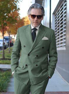 If you treat yourself to some new tailoring, you can't go wrong with our Sage Green Double Breasted Jacket, which offers a trendy statement-making ensemble that is both timeless and adaptable. Our super 120's wool jacket is made with a blend of wool and poly, whereas a solid pattern and green hue instantly give the outfit an eye-catching twist. An excellent option for a fantastic night out or attending a wedding.    Look Includes   Sage Green Fabric  Double Breasted Jacket Style  Peak Lapel   Horn Royal Black  Buttons  Single Vent  Three Cuff Buttons   Click 'Customize Now' to modify the look if needed.   Lining: Viscose; Dry Clean. Grey Check Suit, Mens 3 Piece Suits, Herringbone Tweed Jacket, White Linen Suit, Herringbone Jacket, Black Chinos, Beige Suits, Green Suit, Beautiful Suit