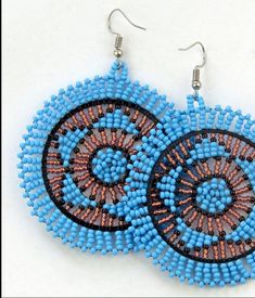 These gorgeous large disc earrings are designed and produced in Kwazulu-Natal.  Each piece is entirely hand beaded by our local team fastened with stainless steel posts. Blue Beaded Circle Jewelry, Nickel-free Round Beaded Earrings For Festival, Artisan Blue Beaded Round Earrings, Beaded Round Earrings For Festival, Traditional Round Beaded Earrings With Large Beads, Artisan Nickel-free Round Beaded Earrings, Nickel Free Round Beads Earrings For Festival, Nickel Free Beaded Earrings For Festival, Blue Round Beaded Earrings