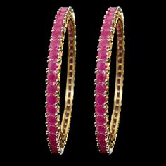 Add a pop of vibrant color to your look with our Pink Bangle from Agulka Jewels. The stunning Ruby Bangle complements the India-inspired design, creating a captivating piece of jewelry. The 22K Gold Plated finish adds a touch of luxury and elegance, while the Pakistani Bangle design brings cultural charm. Elevate your style with this exquisite and sophisticated bangle that exudes grace and allure. Let this be the perfect accessory to make a statement and add a touch of glamour to your ensemble. Diwali Party Bangle, Temple Jewelry Bangle Bracelets For Party, Pink Hand Set Bracelets For Festivals, Red Hand Set Bangle For Party, Pink Bangle Jewelry For Diwali, Hand Set Red Bangle For Celebration, Red Bollywood Bangle For Party, Ruby Bangle For Party, Elegant Multicolor Bangle For Celebration