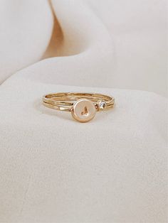 The beautiful initial ring with your birthstone, it's a stunning set of rings, you won’t take off. Personalized by hand with your favorite initial and the beautiful birthstone. A successful ring with a texture that creates its unique shine. This initial ring can be combined with our dainty rings to perfection with our most delicate stackable rings. It also looks minimal and effortless worn alone. * CZ Stone Options: Jan - Garnet Feb - Amethyst Mar - Aquamarine Apr - Diamond May - Emerald Jun - L Set Of Rings, Dainty Rings, Hammered Band, Light Amethyst, Initial Ring, Dainty Ring, Necklace Sizes, Cz Stone, Stackable Rings