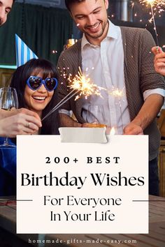 two people celebrating with sparklers and a sign that says, 20 + best birthday wishes for everyone in your life