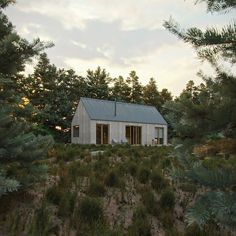 a small white house sitting on top of a lush green hillside surrounded by trees and bushes