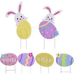 an assortment of easter decorations on sticks