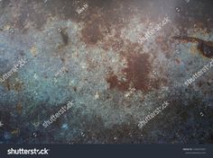 an old rusted metal surface with lots of stains and spots on it, as well as