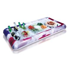 an inflatable tray filled with different types of sushi and other food items