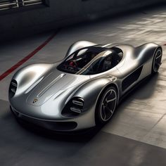 a silver sports car driving down a street