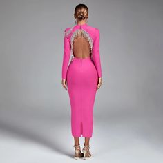 the back of a woman in a pink dress