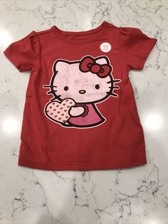 Hello Kitty Valentine T Shirt Infant Girls Size 6-12 Months Red Heart print is glittered on shirt NEW Condition is "New with tags" Clothes To Put On Christmas List, Cute Undershirts, Hello Kitty Shirts Y2k, T - Shirt, Hello Kitty Halloween Shirt, Red Hello Kitty Cotton T-shirt, Red Cotton Hello Kitty T-shirt, Red Hello Kitty Short Sleeve Tops, Red Cotton T-shirt With Hello Kitty Print