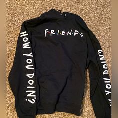 Friends Tv Show Black Sweatshirt, Brand New With Tags. Friends Logo On Front, How You Doing On Both Sleeves And Nothing On The Back. Size Xl Friends Hoodie Tv Show, Letter Print Hoodie For Streetwear, Streetwear Letter Print Hoodie Top, Casual Hooded T-shirt With Logo Print, Casual Hoodie Tops With Logo Print, Black Text Print Crew Neck Hoodie, Black Crew Neck Hoodie With Graphic Print, Casual Letter Print Hoodie Top, Casual Letter Print Hoodie