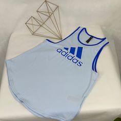 Women's Blue Adidas Tank Top. Light Blue With Cobalt Blue Graphic And Trim. Underarm To Underarm : 17" Shoulder Seam To Hem : 24" Super Soft Fabric- 93% Polyester, 7% Spandex Nwt (#16 Blue Tank Top For Gym And Summer, Blue Tank Top For Gym In Summer, Blue Summer Tank Top For Gym, Blue Cotton Athleisure Tank Top, Adidas Casual Tank Top For Sports, Adidas Blue Sleeveless Top, Adidas Tops For Gym In Spring, Adidas Tops For Gym, Spring Season, Spring Adidas Tops For Gym