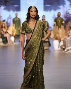 Presenting the Royal Emerald Saree from the #AjrakhGoesBoho collection by @labelnityabajaj, showcased at @timesfashionweek. This stunning saree features intricate Ajrakh Badami block prints, complemented by exquisite border and pallu detailing adorned with hand-embroidered sequins, zari, and pearls. Perfect for your mehendi ceremony this summer, especially when paired with elegant emerald jewelry.  Be the first to shop this luxurious look, available soon at www.nityabajaj.com.  ✨ Designer: @labelnityabajaj 🎬 Show Director: @lokeshsharmaofficial 👗 Stylist: @bharatg18 📸 Photography: @shuttergaurav & @gauravsharmaproductions 💍 Jewelry: @tribebyamrapali 📊 Agency: @runwayfashionmanagement 📣 PR: @convizo_  Celebrate your special occasion with a touch of bohemian luxury and traditional eleg Emerald Saree, Traditional Indian Dresses, Wedding Anarkali, Ajrakh Sarees, Reception Saree, Mehendi Ceremony, Mother Dearest, Organza Lehenga, Ruffle Saree