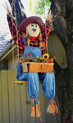 an image of a scarecrow on a swing