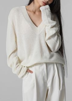 Color: Cream Lightweight wool blend fabric Regular fit Deep v neck Drop shoulders Rib knit trim Slip on style Unlined 35% Polyamide 30% Wool 25% Alpaca 10% Acrylic Dry Clean Imported The Frankie Shop, Frankie Shop, Knitwear Women, V Neck Sweater, Deep V Neck, Deep V, Vneck Sweater, Cream Color, Drop Shoulder