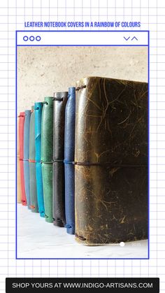 the leather notebook covers in rainbow colors are lined up next to each other