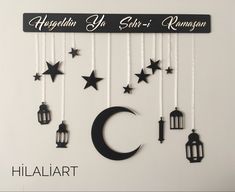 there is a sign that says hiallart with stars and lanterns hanging from it