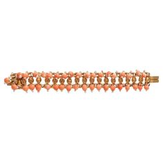 Antique Coral and Seed Pearl Gold Fringe Bracelet Discover the timeless elegance of our Antique Gold Coral and Seed Pearl Fringe Bracelet, a stunning piece that seamlessly blends late 19th Century charm with modern style. This exquisite bracelet features vibrant coral and delicate seed pearls, creating a playful fringe design that adds a touch of fun to any outfit. The rich gold setting beautifully enhances the natural hues of the coral, making it a standout accessory for both casual and formal Pearl Fringe, Fringe Bracelet, Gold Fringe, The Coral, Seed Pearl, Coral Beads, Gold Set, Pearl Bracelet, Link Bracelets